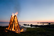 Beautiful bonfire by the sea during the sunset Beautiful bonfire by the sea during the sunset