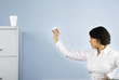 Businesswoman throwing wastepaper into styrofoam cup