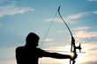 Attractive young archer sight his target Attractive young archer sight his target