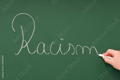 Photo: Racism written on a blackboard Racism written on a blackboard