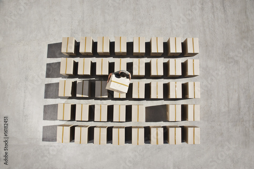 Photo: Man organizing boxes outdoors Man organizing boxes outdoors