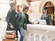 Hotel receptionist checking couple in