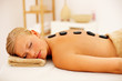 Beautiful woman getting pampered with stone therapy Beautiful woman getting pampered with stone therapy