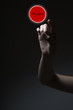 finger pressing the red button