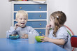 Children eating snacks in classroom
