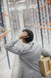 Businessman carrying box in warehouse