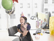 Businesswoman having birthday party at desk