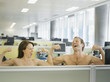 Naked businesspeople flexing muscles in office