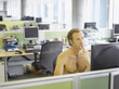 Nude businessman sitting at desk