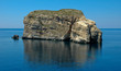 Giant Rock and Small Boat outside Malta
