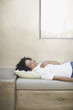 Woman napping on patio bench