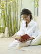 Woman reading on patio