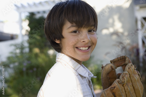 Photo: Boy holding baseball glove Boy holding baseball glove