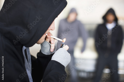 Photo: Man lighting marijuana cigarette Man lighting marijuana cigarette