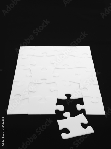 Photo: Puzzle with one piece out of place Puzzle with one piece out of place
