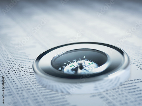 Photo: Compass on list of share prices Compass on list of share prices