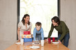 Photo: young family celebrating fifth birthday of the son young family celebrating fifth birthday of the son