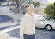 Man using keyless lock on car in driveway