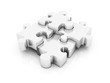 silver puzzle in pieces over a white background