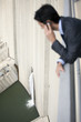 Businessman looking at water spilling from dam