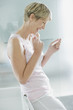 Excited woman looking at pregnancy test