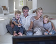 Family watching television together