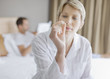 Woman looking at pill
