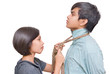 Girl knotting necktie of boy Girl knotting necktie of boy