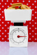 kitchen scales with cookies weight loss diet concept