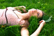 beautiful girl lying down of grass