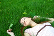 beautiful girl lying down of grass