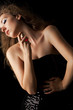 blond woman applying perfume on her body blond woman applying perfume on her body