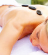 Closeup of a woman getting a stone massage therapy