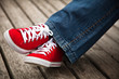 Red sneakers and jeans Red sneakers and jeans