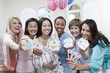 Pregnant Asian Woman with friends at a Baby Shower