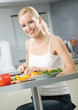 Young happy smiling woman cooking salad at home Young happy smiling woman cooking salad at home