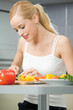 Young happy smiling woman cooking salad at home Young happy smiling woman cooking salad at home