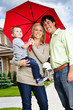 Happy family with umbrella