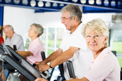 Photo: Older people exercising in the gym Older people exercising in the gym