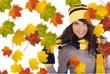 Beautiful  woman wearing hat and gloves  and maple leaves