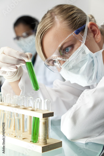 Photo: Female Scientific Research Team With Green Solution In Laborator Female Scientific Research Team With Green Solution In Laborator