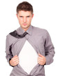 young attractive man pulling at his t-shirt
