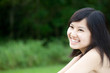 Photo: Beautiful Asian girl smiling outdoors Beautiful Asian girl smiling outdoors