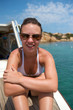 Pretty woman enjoying her trip on a sailboat Pretty woman enjoying her trip on a sailboat