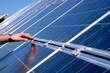 Photo: Touching a solar panel Touching a solar panel