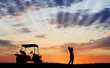 Silhouette of golfer with golf cart Silhouette of golfer with golf cart