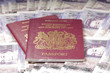 UK Passports on money background UK Passports on money background