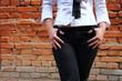 woman near the brick wall