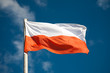 Polish flag against blue sky Polish flag against blue sky