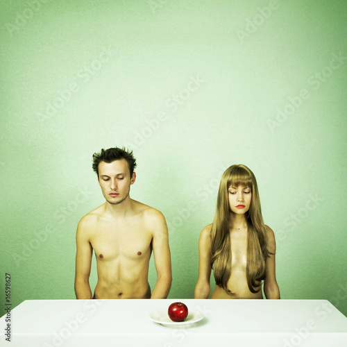 Photo: Two nude lovers with apple Two nude lovers with apple